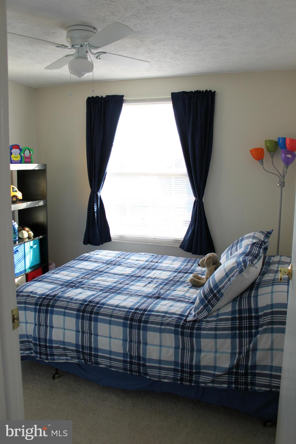4404 Cub Run Road Chantilly, VA 20151 - Photo 20 of 30 a bedroom with a bed wooden floor and window