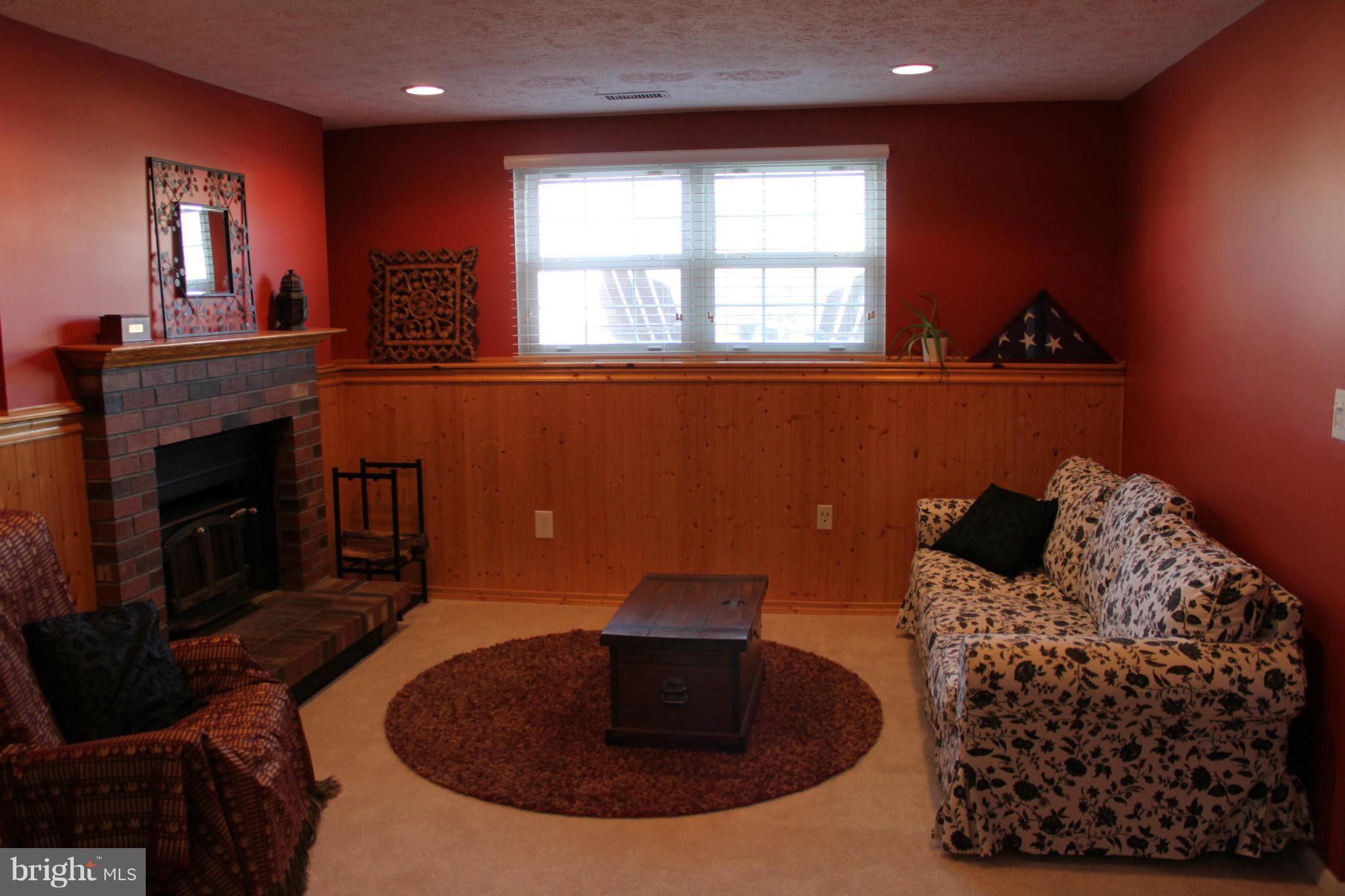 4404 Cub Run Road Chantilly, VA 20151 - Photo 22 of 30 a living room with furniture and a fireplace