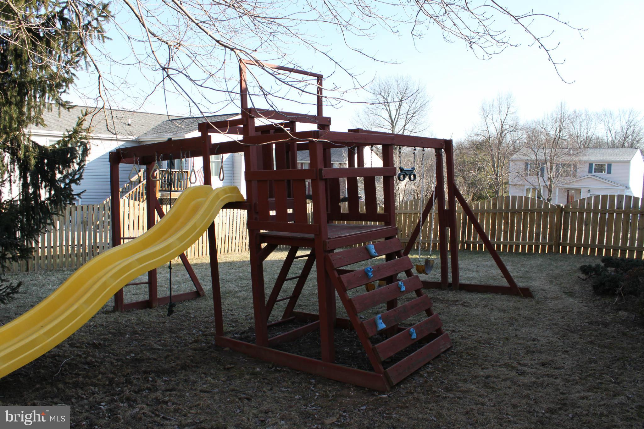 4404 Cub Run Road Chantilly, VA 20151 - Photo 30 of 30 a view of a roof deck with wooden chairs and stairs