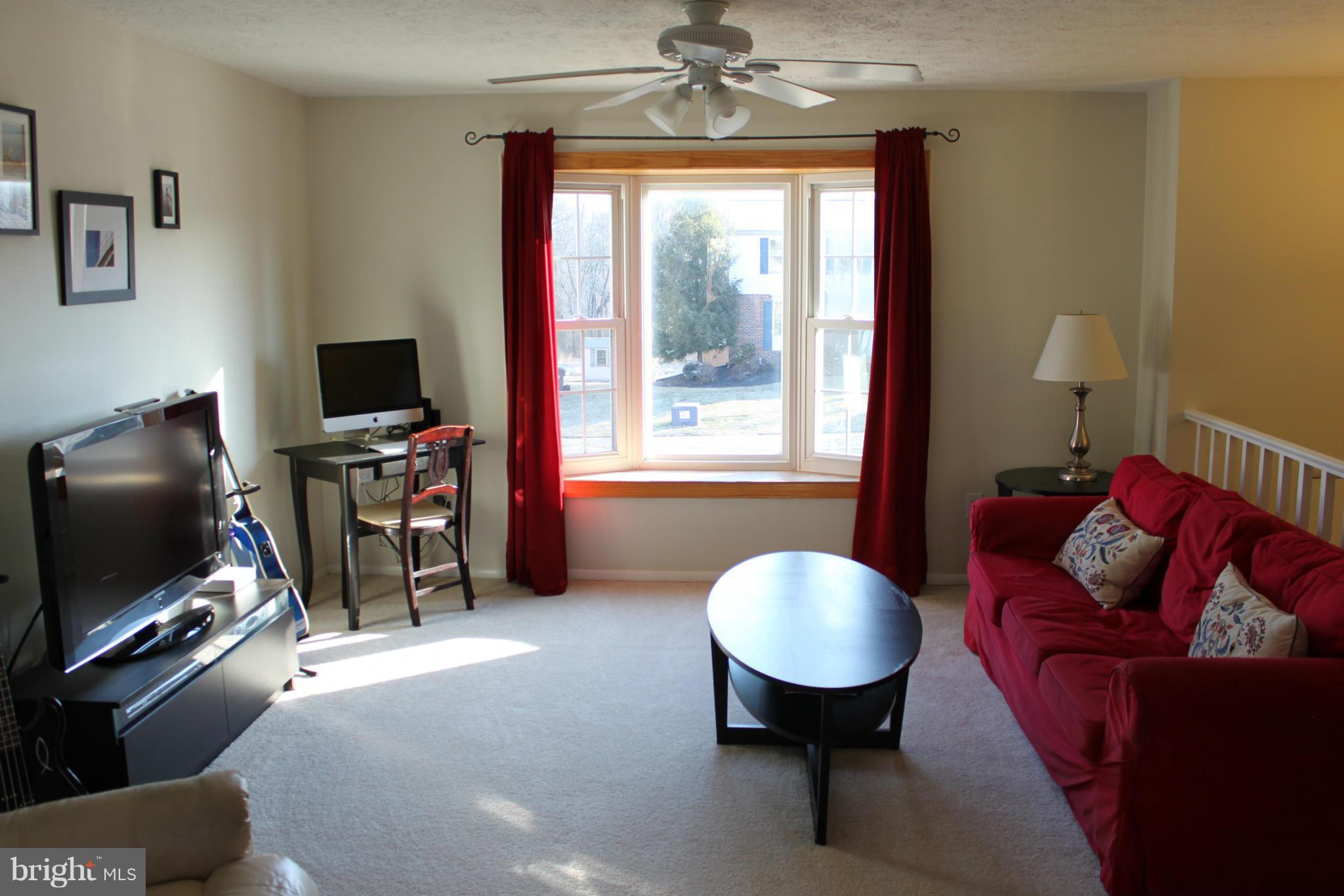 4404 Cub Run Road Chantilly, VA 20151 - Photo 5 of 30 a living room with furniture a window and a flat screen tv