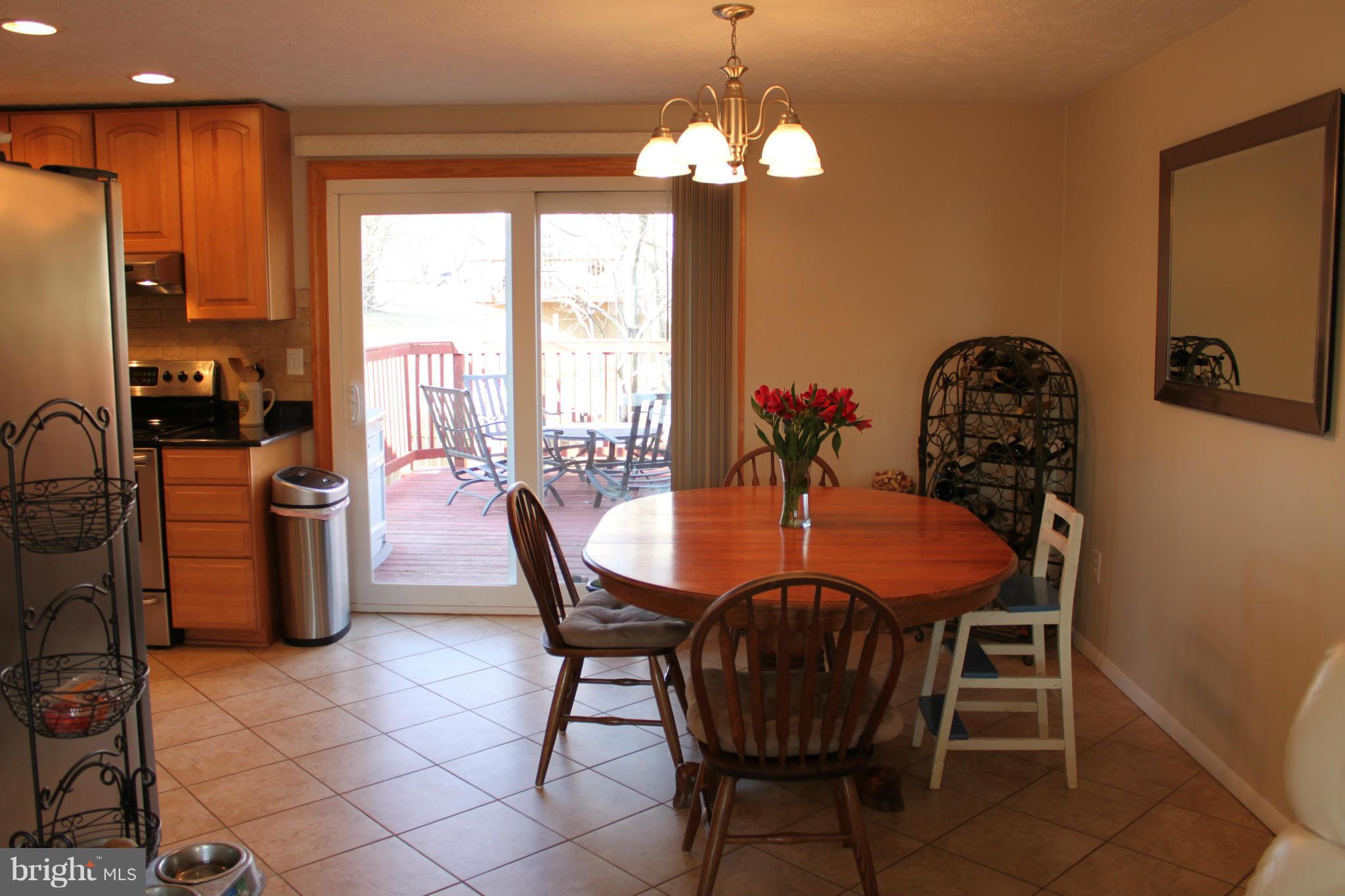 4404 Cub Run Road Chantilly, VA 20151 - Photo 6 of 30 a view of a dining room with furniture window and outside view