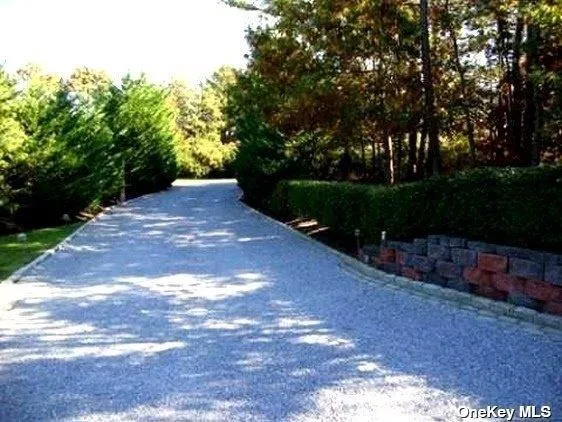 a view of a street with a yard