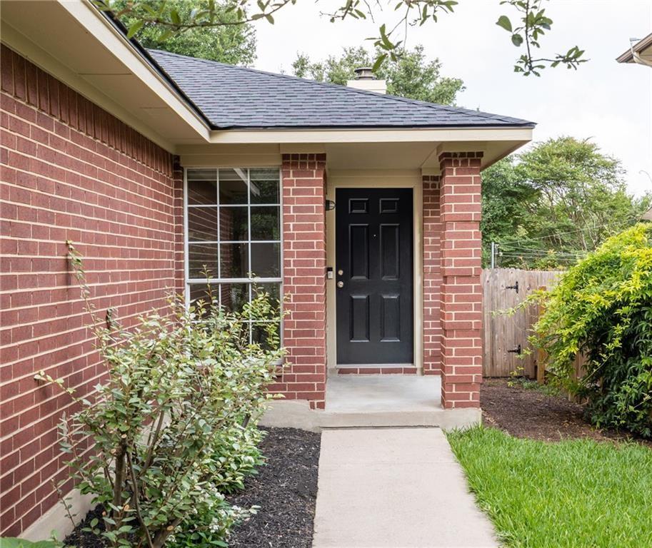 4526 Corran Ferry Loop Austin, TX 78749 - Photo 5 of 25 A welcoming front entrance featuring robust brick masonry and a classic paneled entry door.