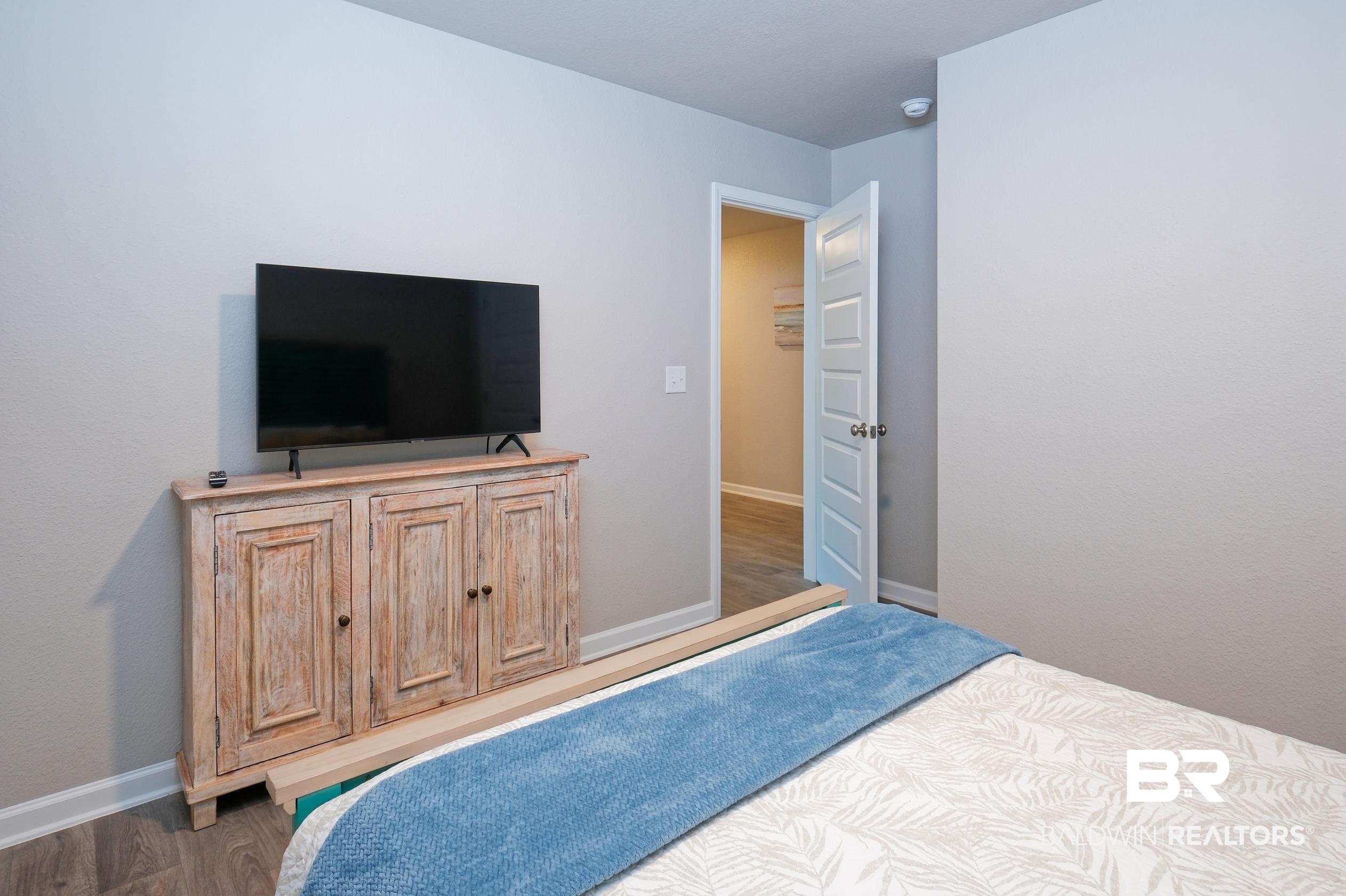 7425 Coppin Drive Foley, AL 36535 - Photo 35 of 41 Bedroom featuring dark hardwood / wood-style floors