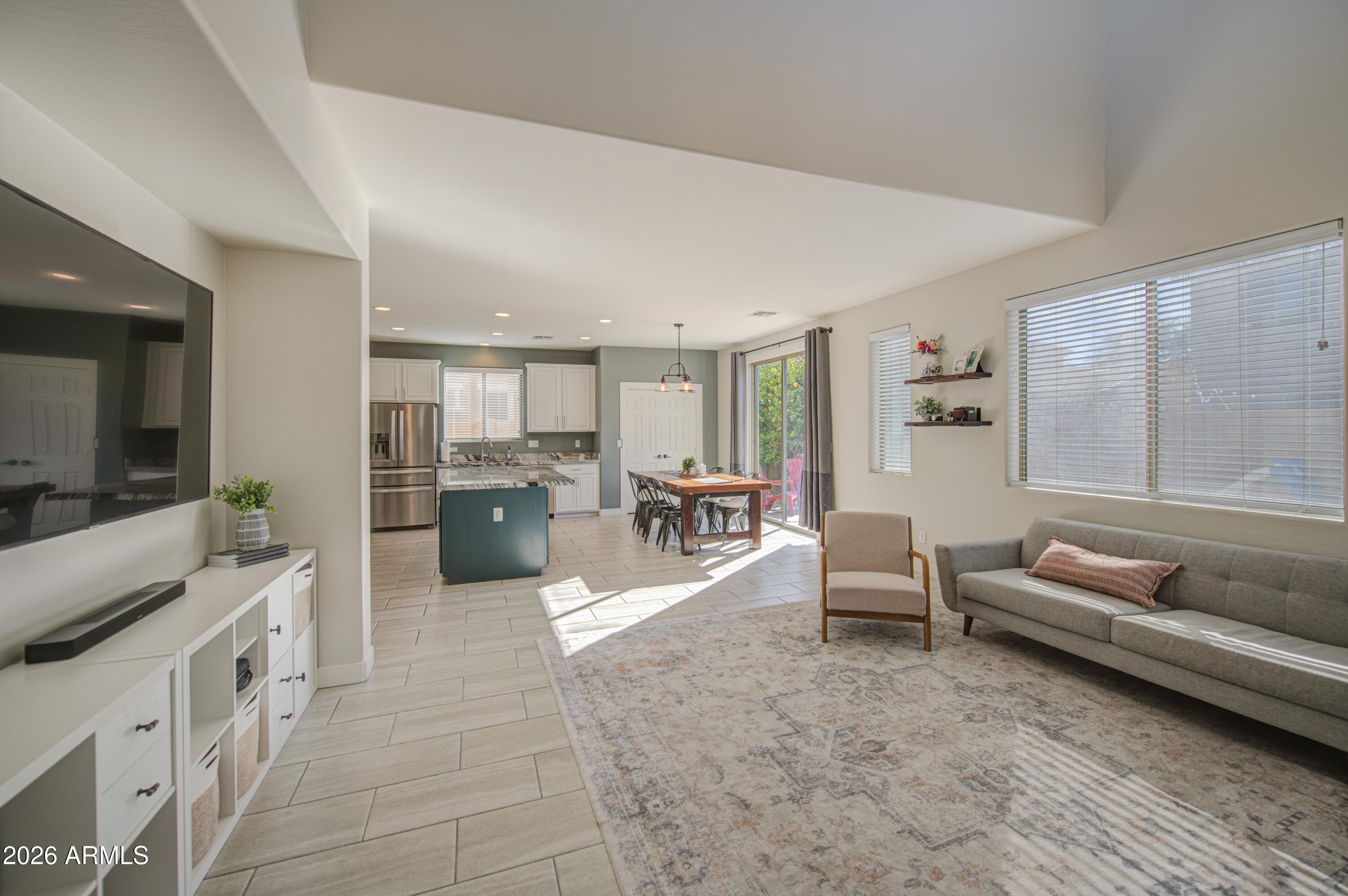 21303 East Alyssa Road Queen Creek, AZ 85142 - Photo 14 of 29 a living room with furniture and a flat screen tv