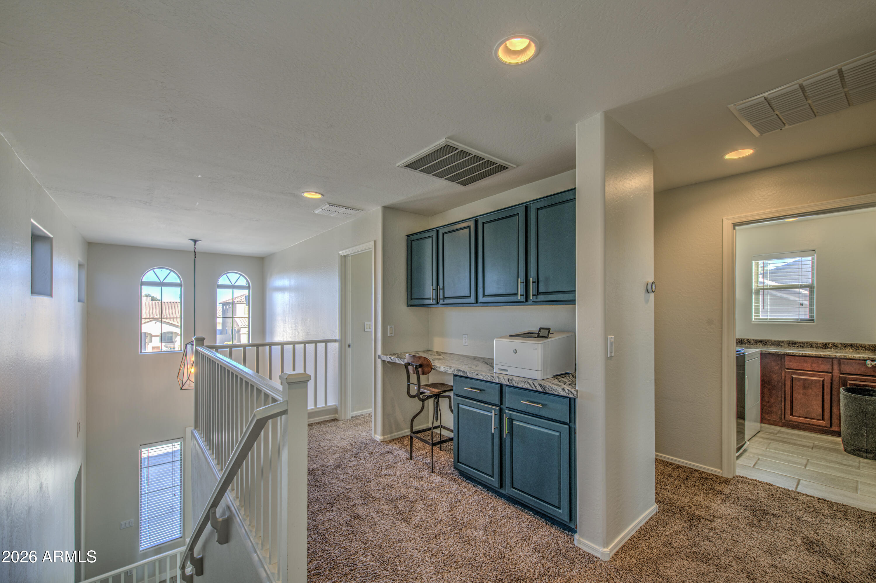 21303 East Alyssa Road Queen Creek, AZ 85142 - Photo 21 of 29 a view of a hallway and an dining rom with furniture