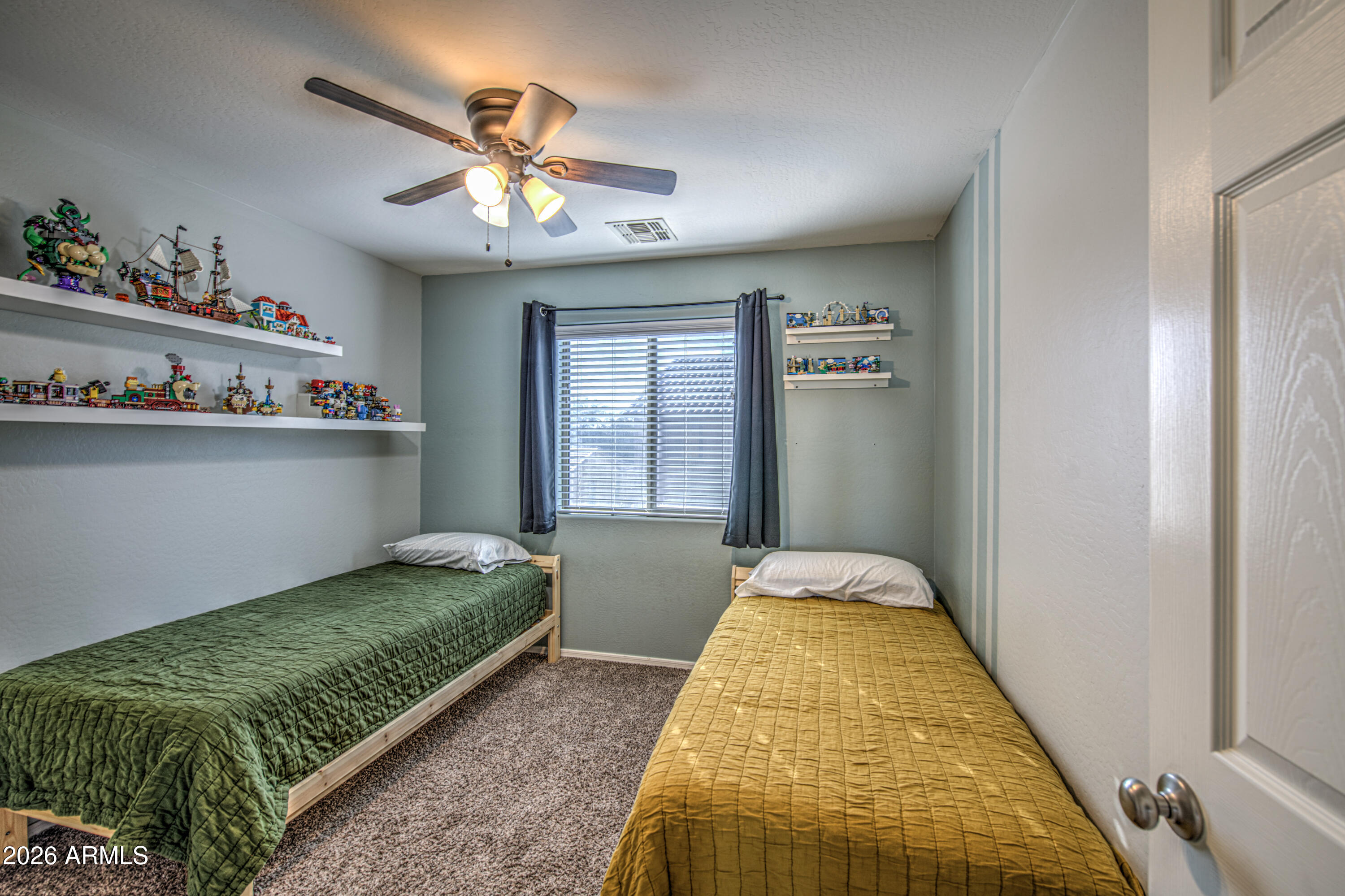21303 East Alyssa Road Queen Creek, AZ 85142 - Photo 24 of 29 a bedroom with a bed and ceiling fan