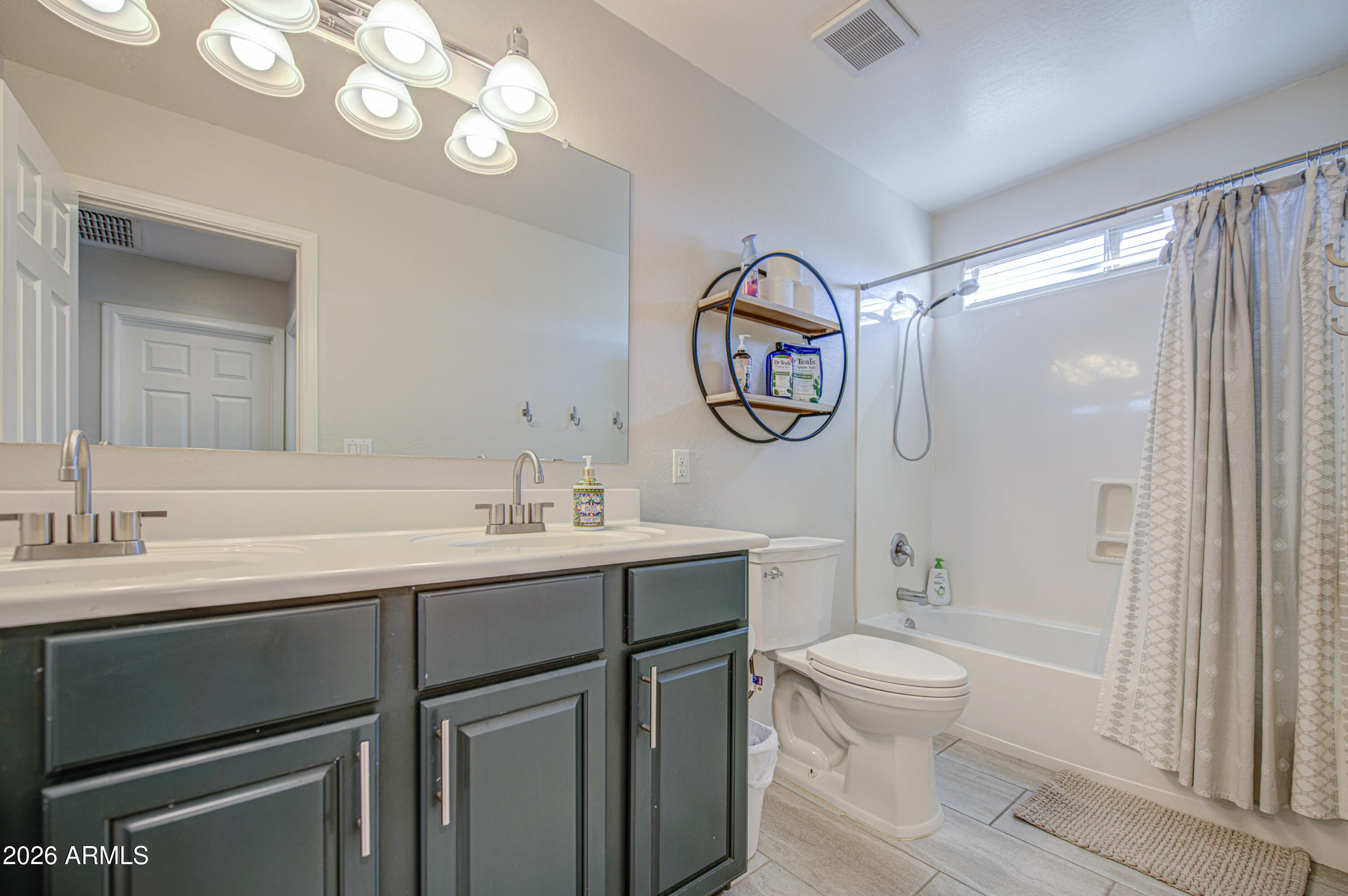 21303 East Alyssa Road Queen Creek, AZ 85142 - Photo 26 of 29 a bathroom with a granite countertop sink a toilet and a shower