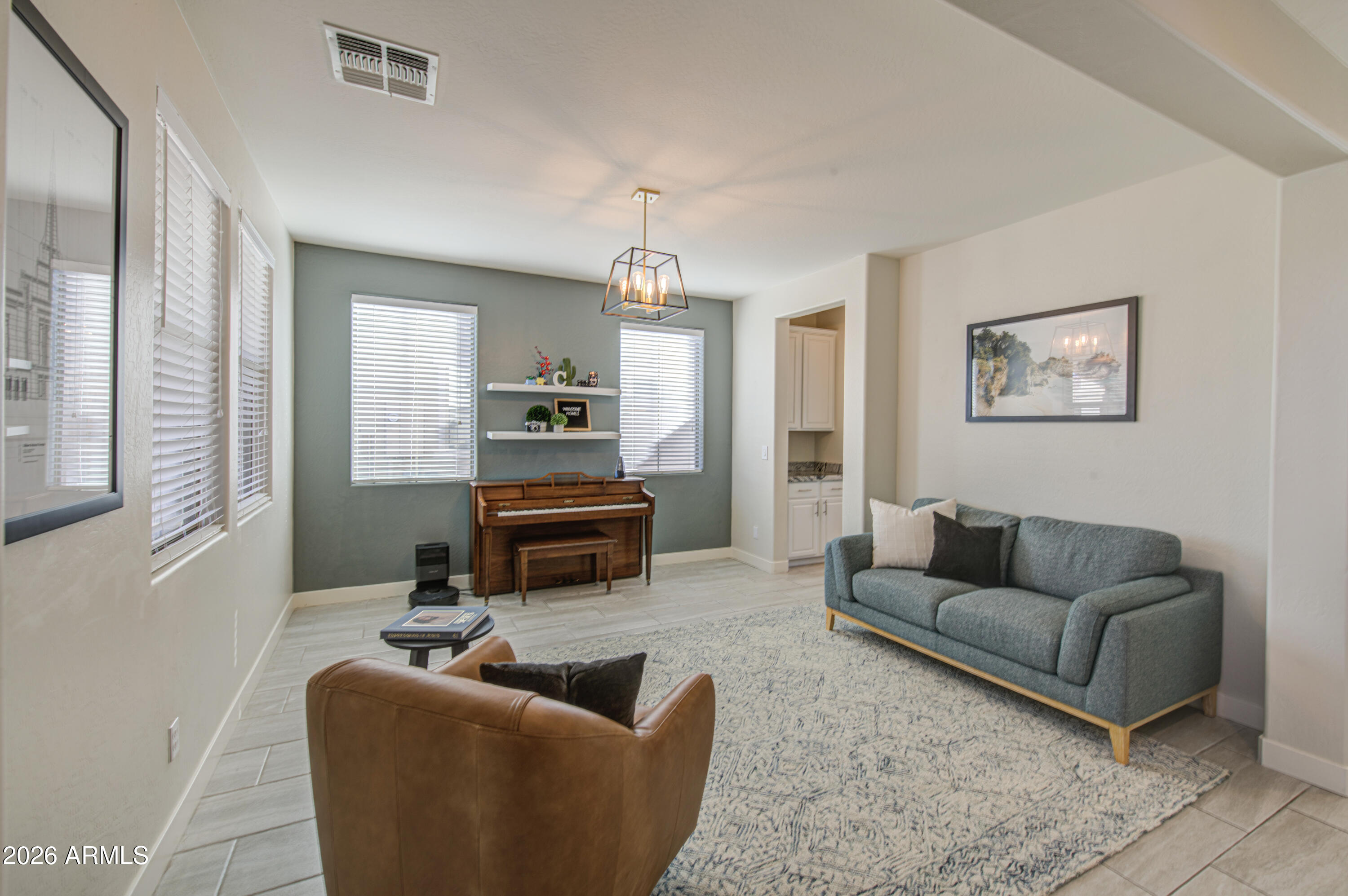 21303 East Alyssa Road Queen Creek, AZ 85142 - Photo 4 of 29 a living room with furniture and a fireplace