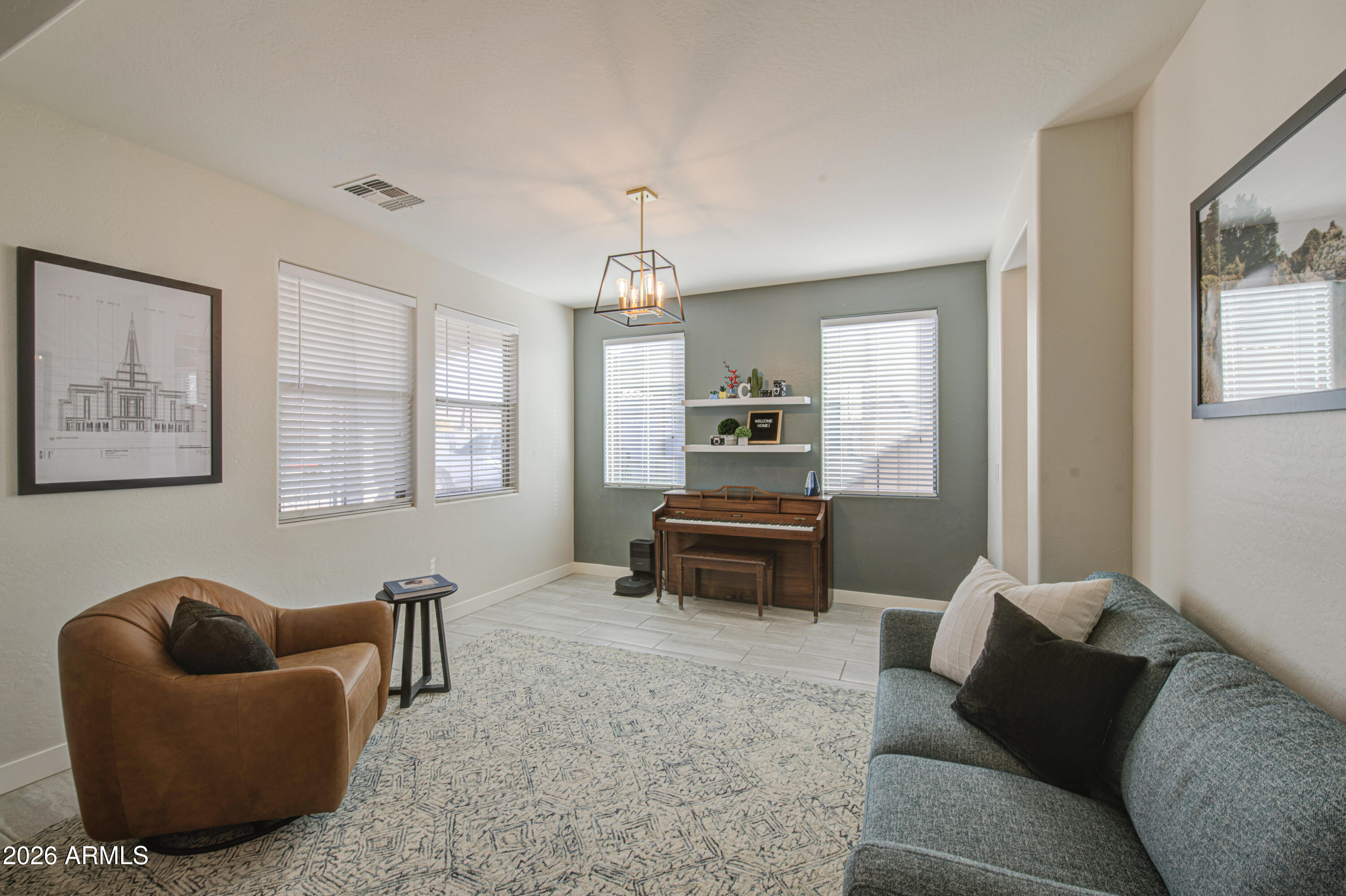 21303 East Alyssa Road Queen Creek, AZ 85142 - Photo 5 of 29 a living room with furniture and a window