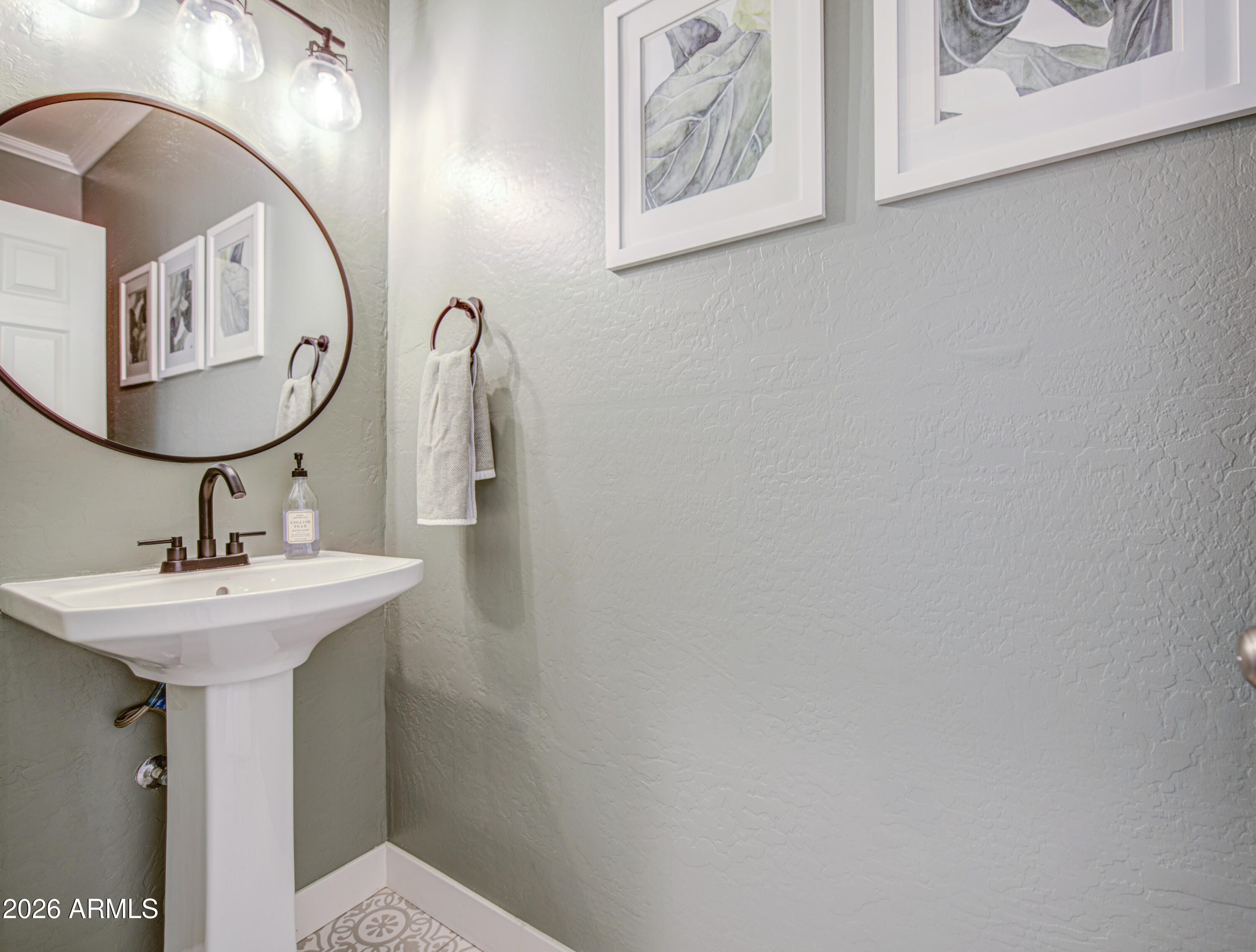 21303 East Alyssa Road Queen Creek, AZ 85142 - Photo 8 of 29 a bathroom with a sink and mirror