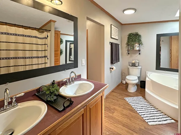 a white toilet sitting next to a bathroom sink