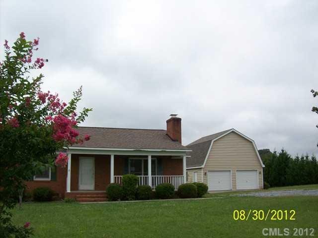 201 Owens Road York, SC 29745 - Photo 1 of 7 a front view of a house with garden
