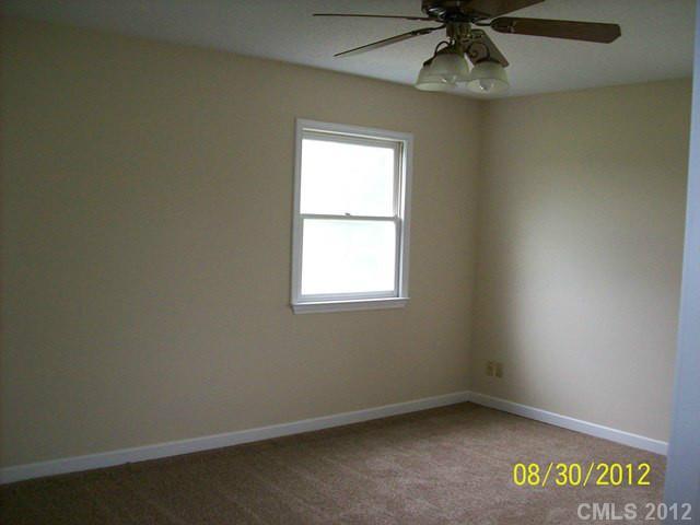201 Owens Road York, SC 29745 - Photo 5 of 7 an empty room with a window and a fan