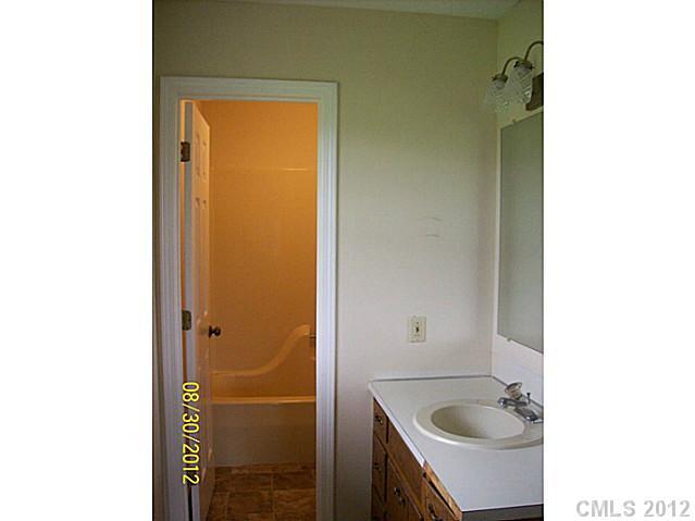 201 Owens Road York, SC 29745 - Photo 6 of 7 a bathroom with a sink and shower
