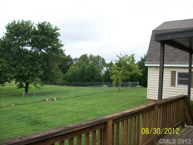 201 Owens Road York, SC 29745 - Photo 7 of 7 a view of a wooden deck and a big yard