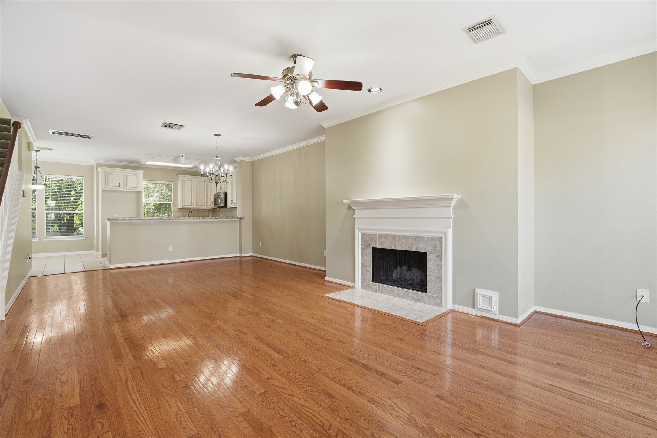 1809 Gillette Street Houston, TX 77019 - Photo 13 of 35 a view of an empty room with wooden floor fireplace and a window