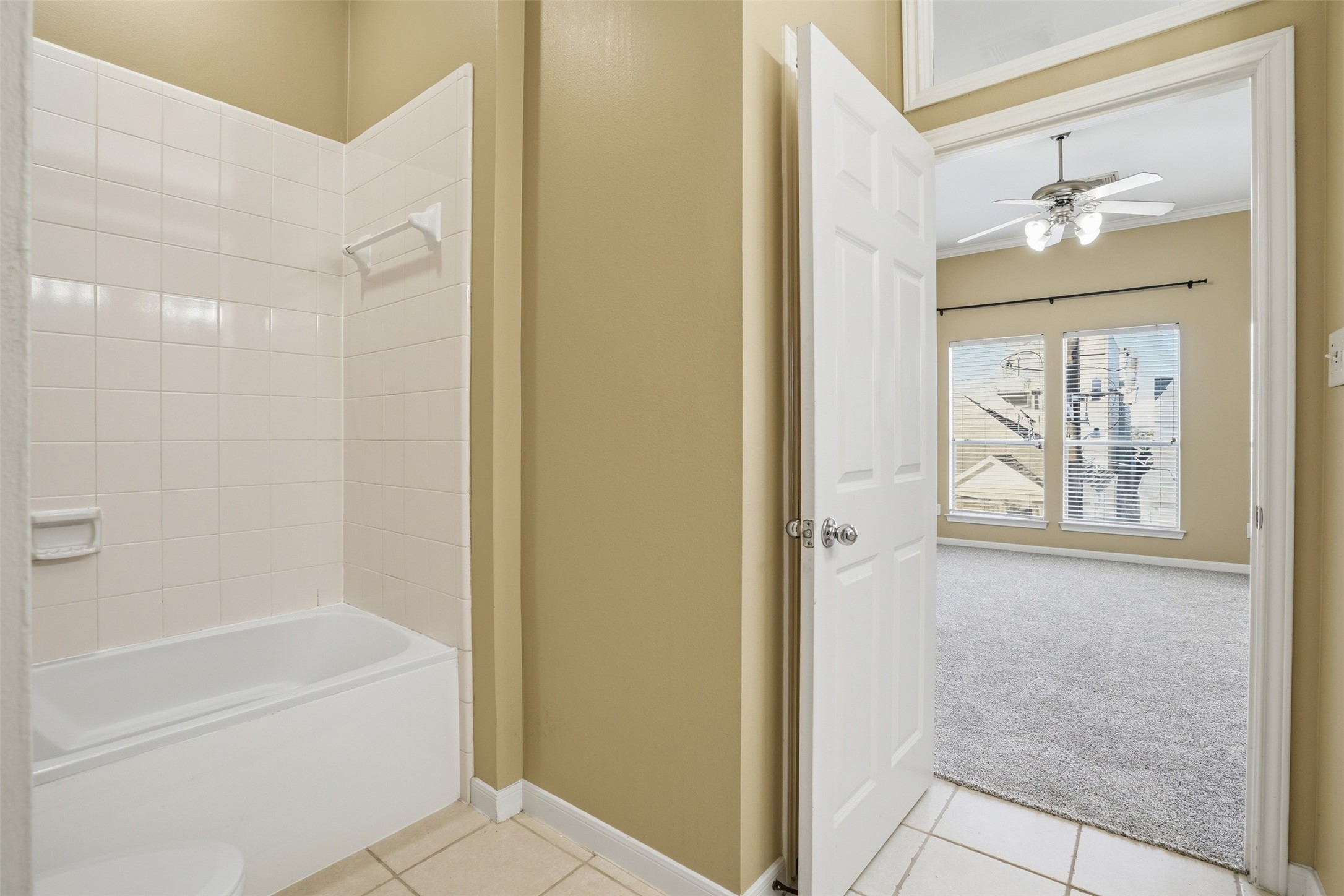 1809 Gillette Street Houston, TX 77019 - Photo 22 of 35 a bathroom with a bathtub a shower and a mirror