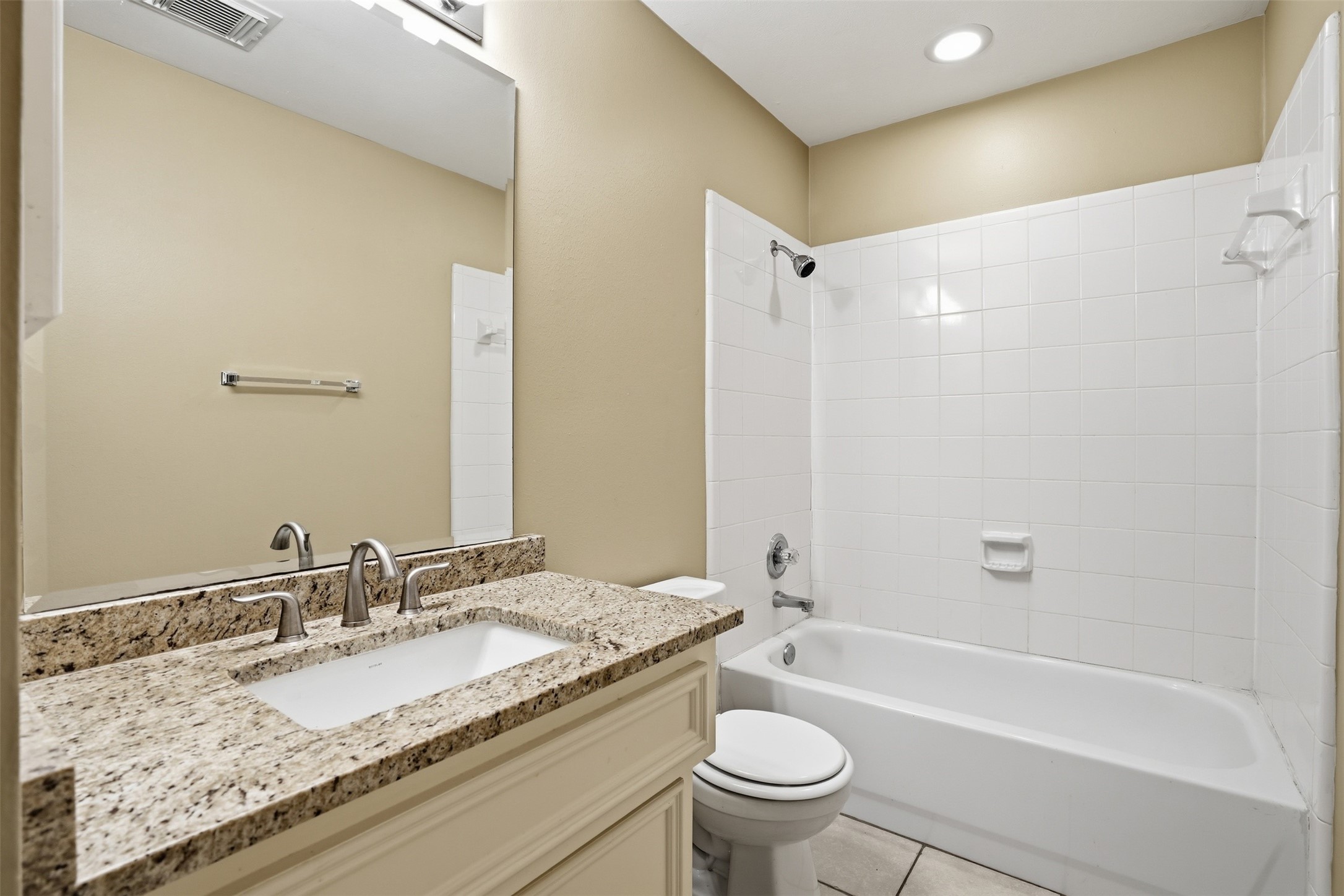 1809 Gillette Street Houston, TX 77019 - Photo 8 of 35 a bathroom with a granite countertop sink mirror toilet and bathtub