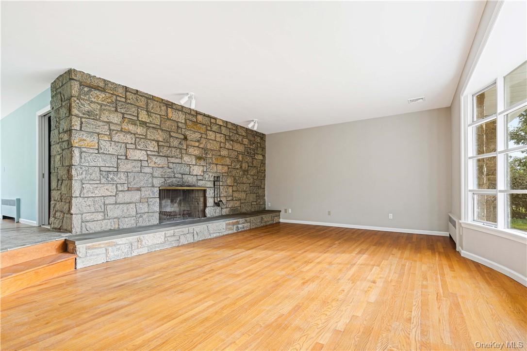 5 Paddock Road Rye Brook, NY 10573 - Photo 3 of 23 Living room featuring original stone fireplace