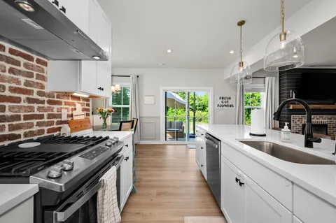 a kitchen with a stove and a sink