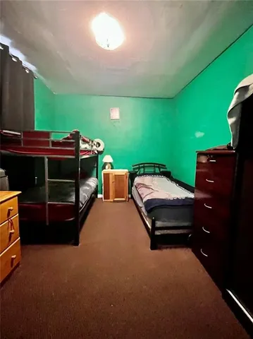 a backyard of a house with a yard and outdoor seating