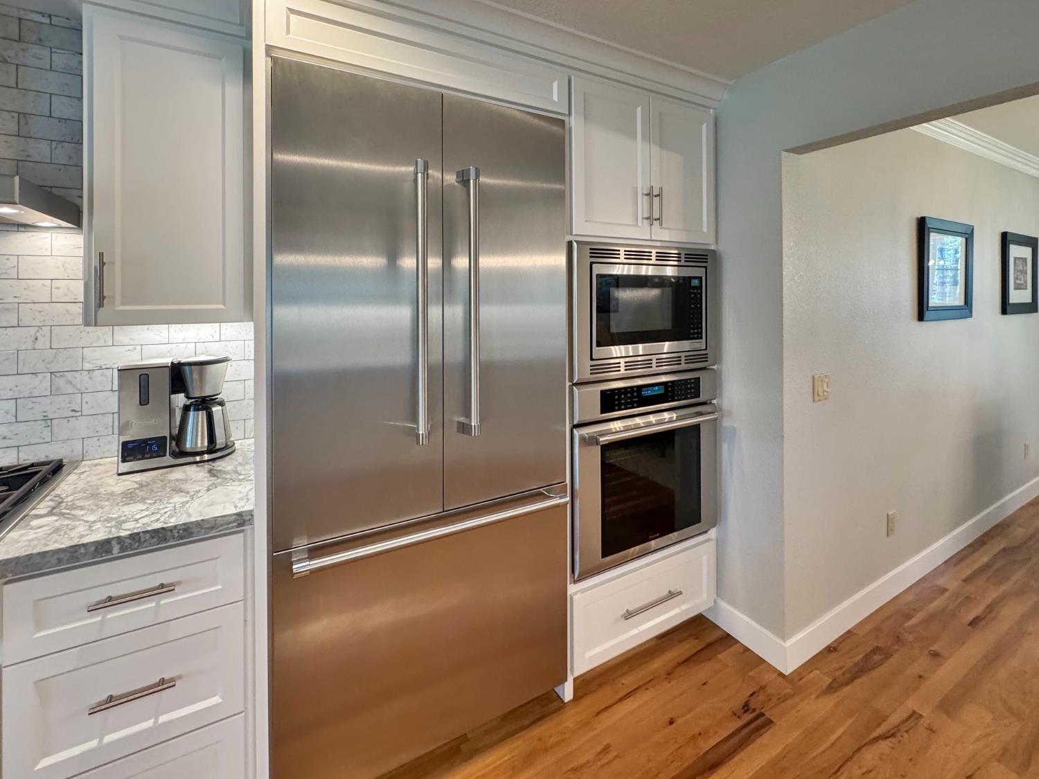 1795 Volley Road Meadow Vista, CA 95722 - Photo 11 of 34 a kitchen with a refrigerator and a stove