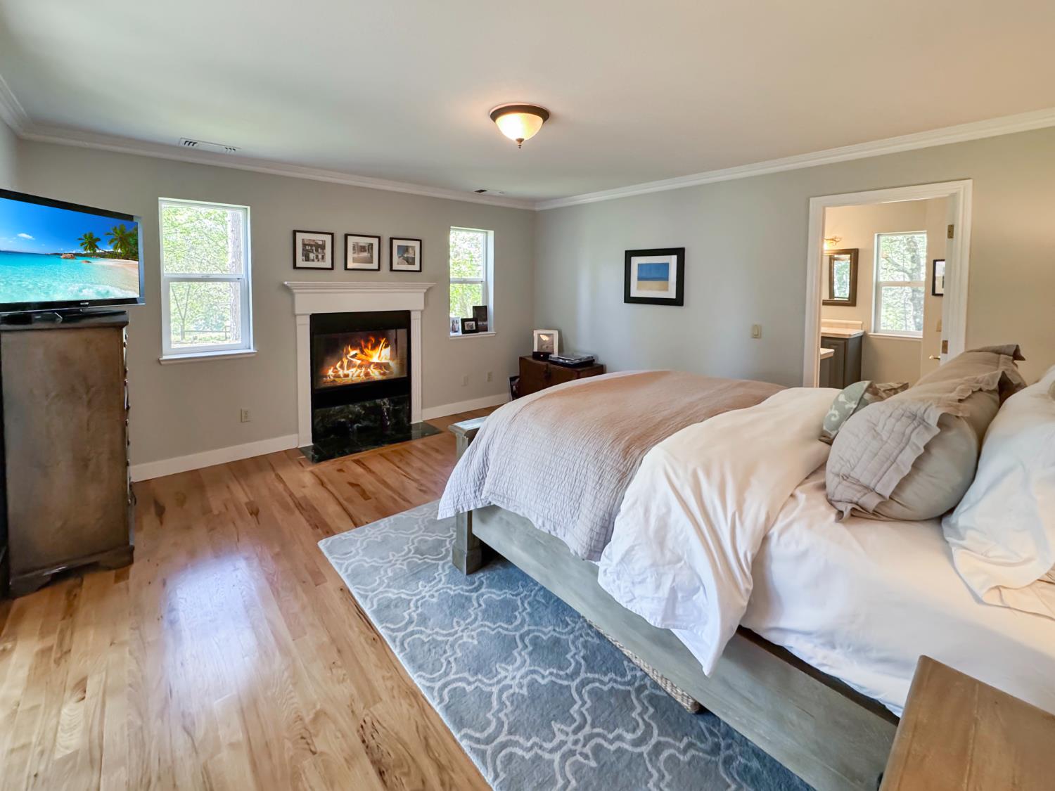 1795 Volley Road Meadow Vista, CA 95722 - Photo 14 of 34 a spacious bedroom with a bed and a fireplace