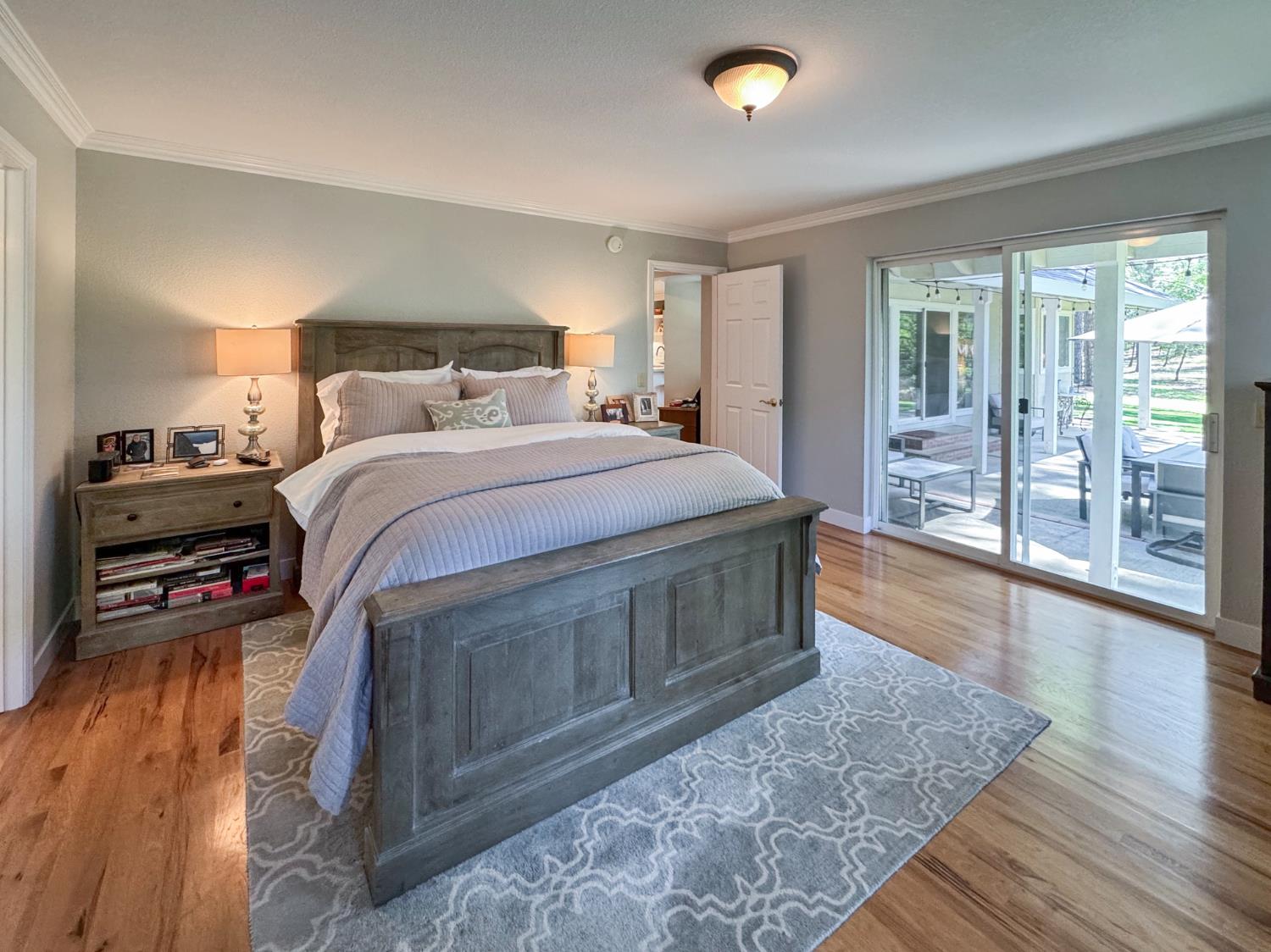 1795 Volley Road Meadow Vista, CA 95722 - Photo 15 of 34 a bedroom with a bed and a large window