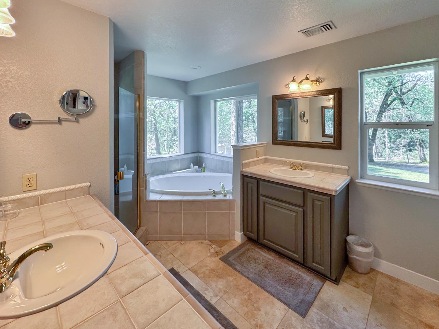 1795 Volley Road Meadow Vista, CA 95722 - Photo 17 of 34 a bathroom with a sink and a mirror
