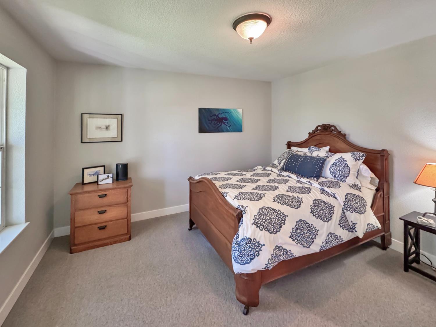 1795 Volley Road Meadow Vista, CA 95722 - Photo 19 of 34 a bedroom with a bed and a cabinets