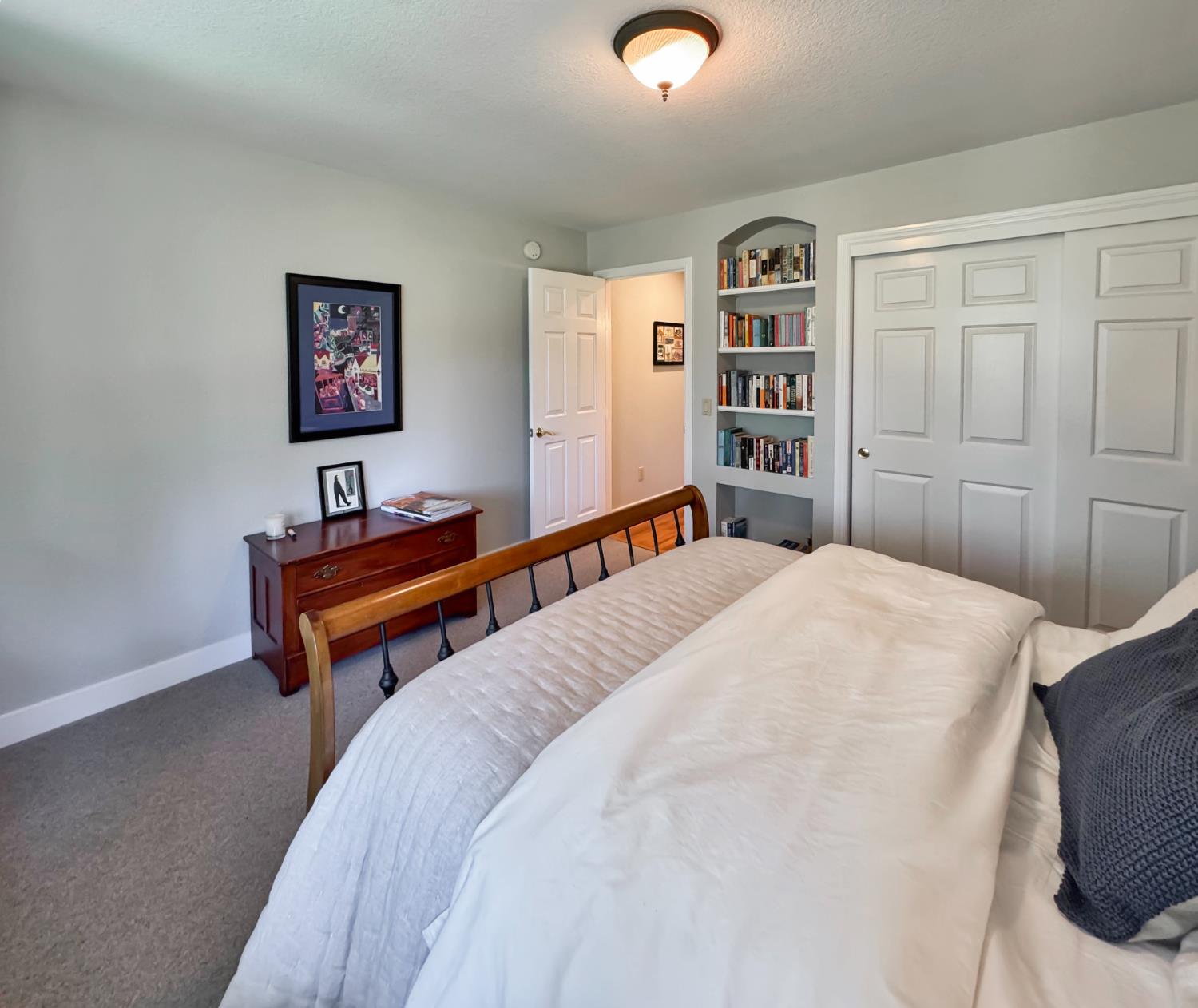 1795 Volley Road Meadow Vista, CA 95722 - Photo 21 of 34 a bedroom with a bed and a bookshelf