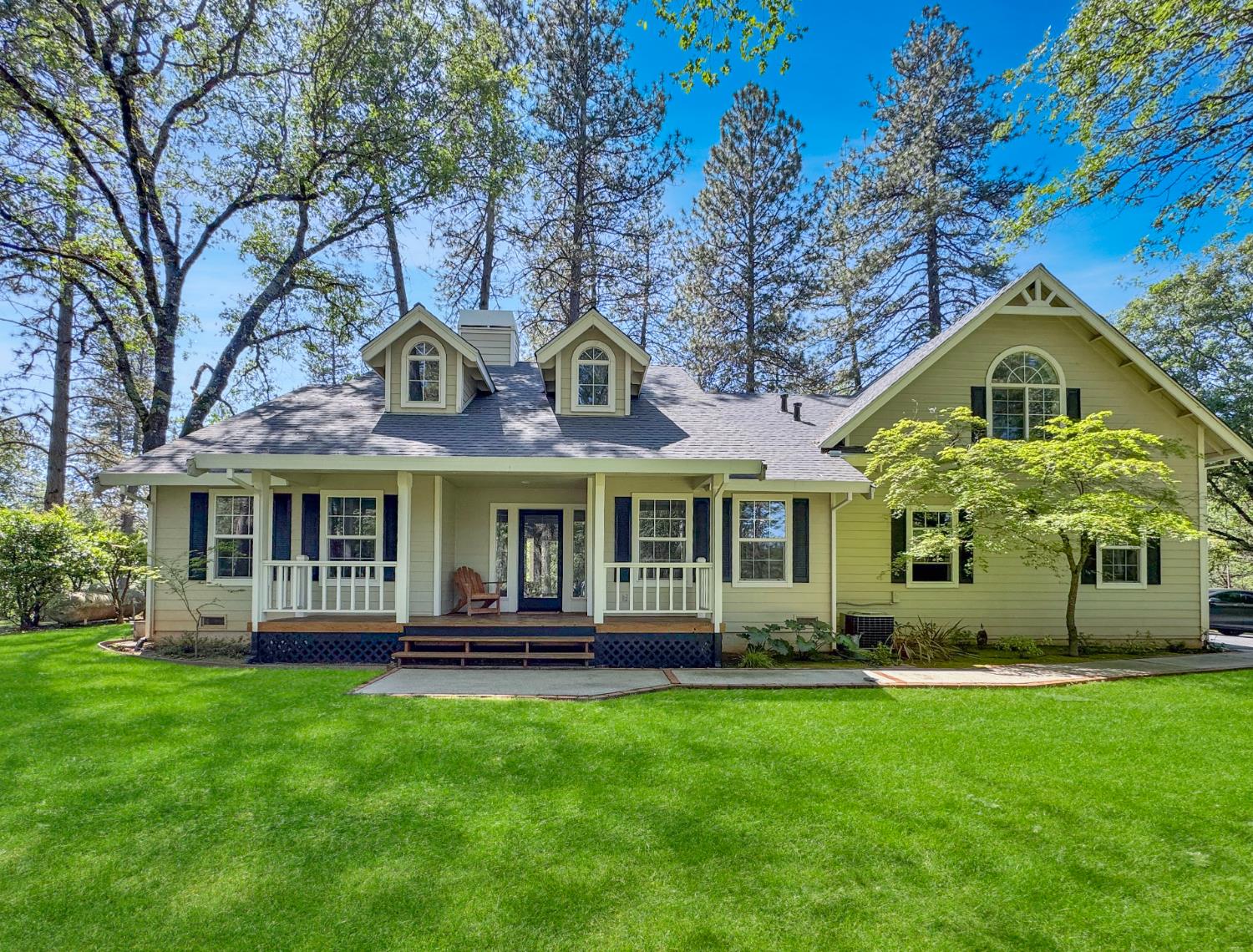 1795 Volley Road Meadow Vista, CA 95722 - Photo 32 of 34 a front view of a house with a garden
