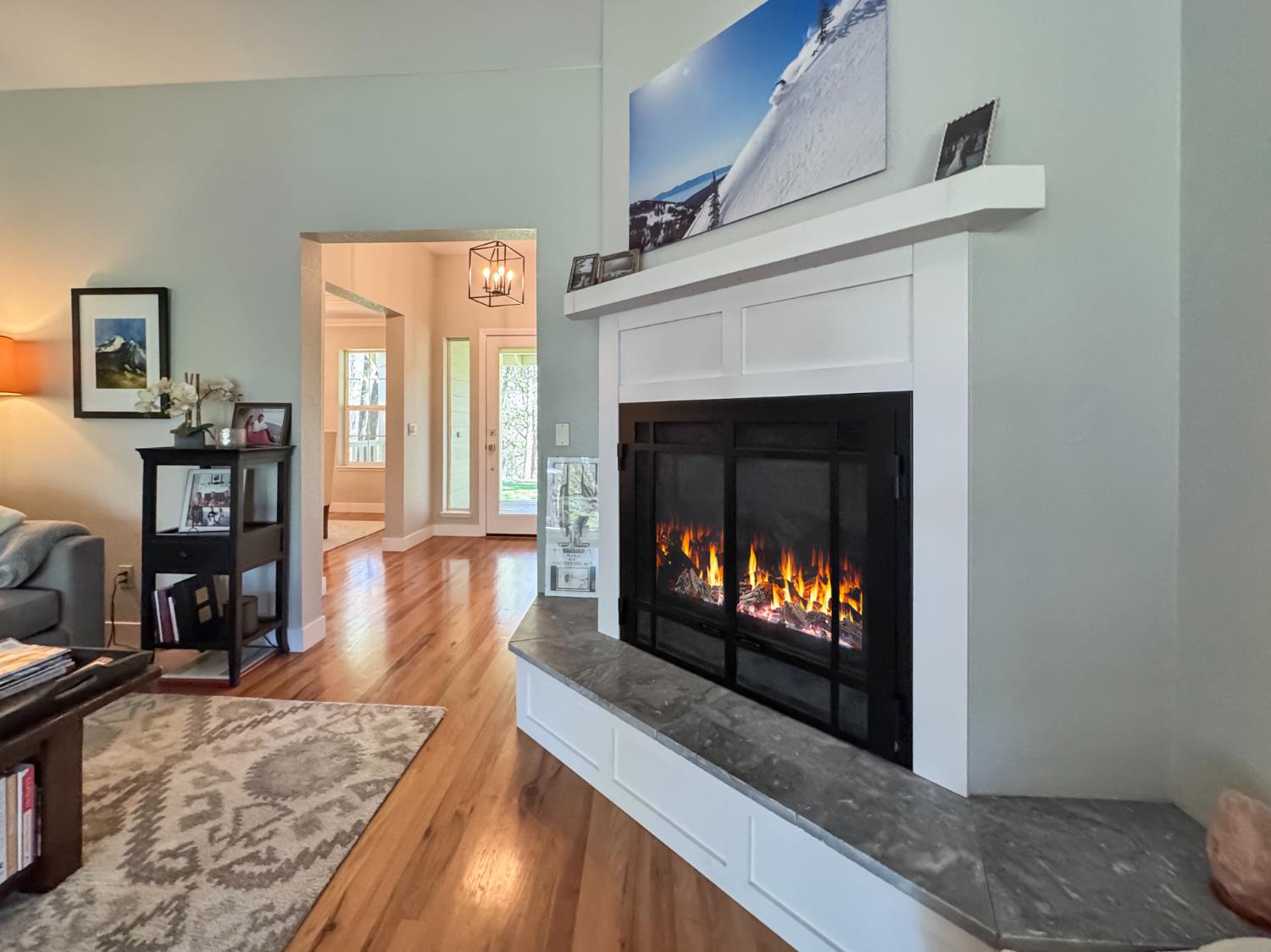 1795 Volley Road Meadow Vista, CA 95722 - Photo 8 of 34 a living room with furniture a fireplace and a flat screen tv