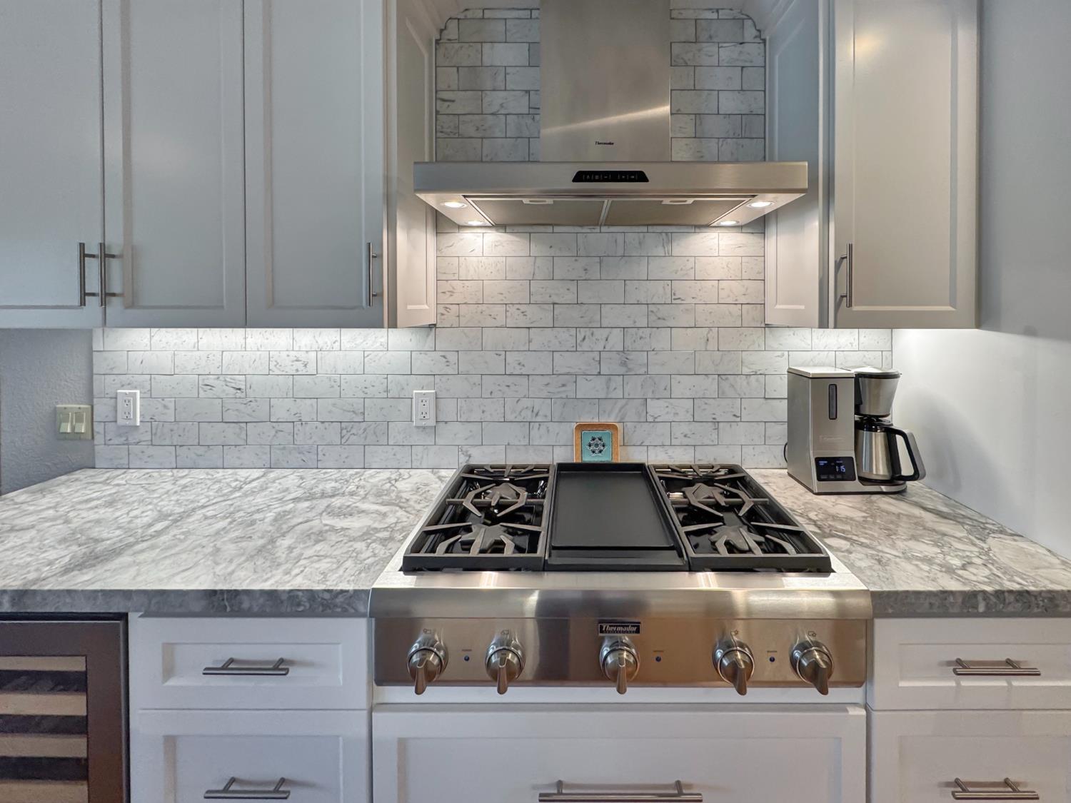 1795 Volley Road Meadow Vista, CA 95722 - Photo 10 of 34 a stove top oven sitting inside of a kitchen