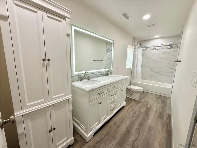 a bathroom with a shower and a bath tub