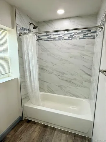 a bedroom with a bed and dresser