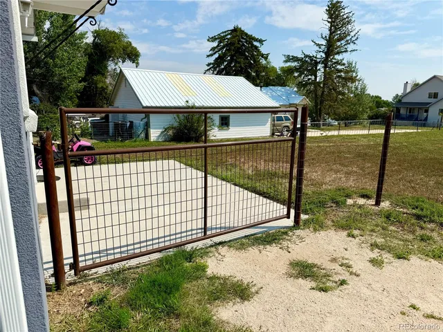 a view of swimming pool with a backyard