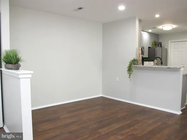 a view of kitchen with wooden floor