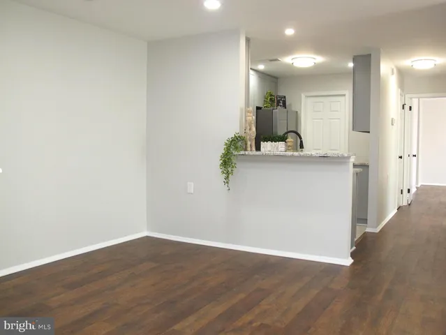 a view of kitchen with wooden floor