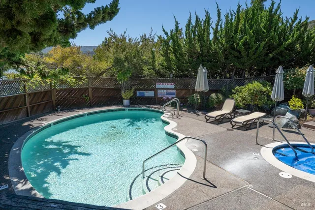 a view of a backyard with sitting area