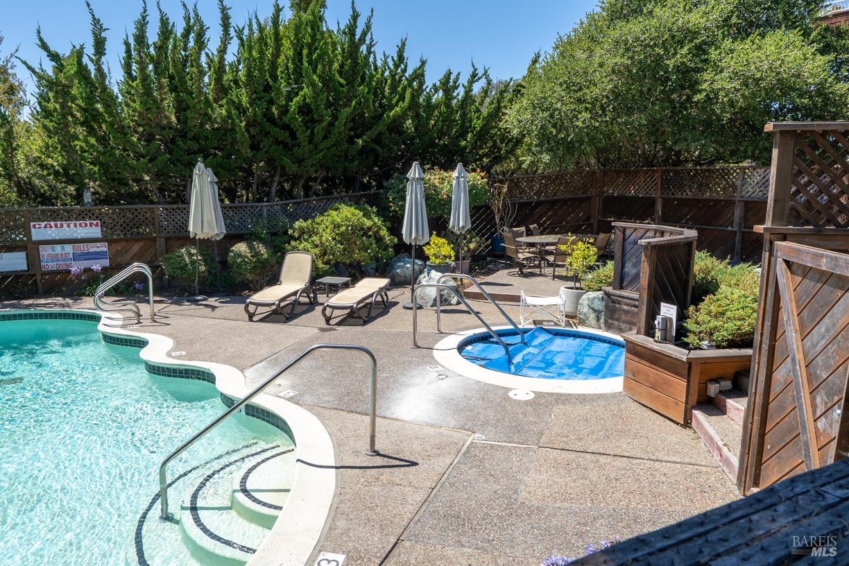 110 Seminary Drive, Unit 1A Mill Valley, CA 94941 - Photo 17 of 27 a view of a swimming pool and lounge chairs
