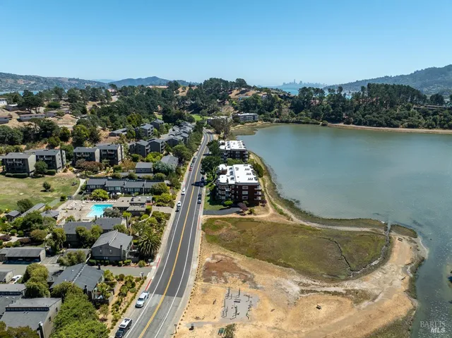an aerial view of a house with a lake view