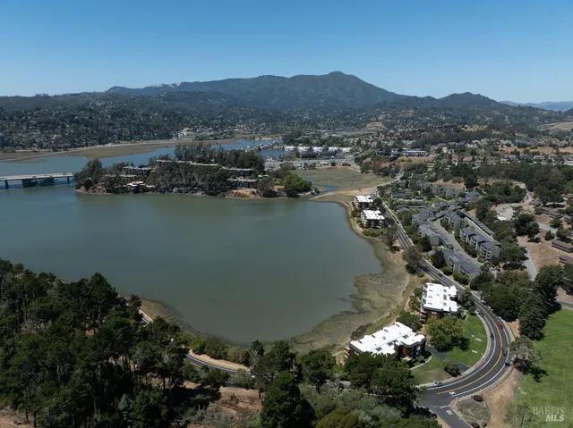 an aerial view of a house with a lake view