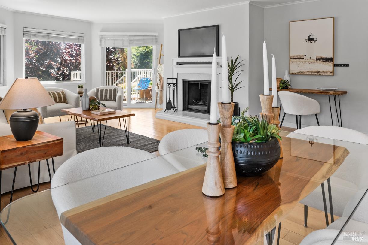 110 Seminary Drive, Unit 1A Mill Valley, CA 94941 - Photo 6 of 27 a living room with furniture a fireplace and potted plants