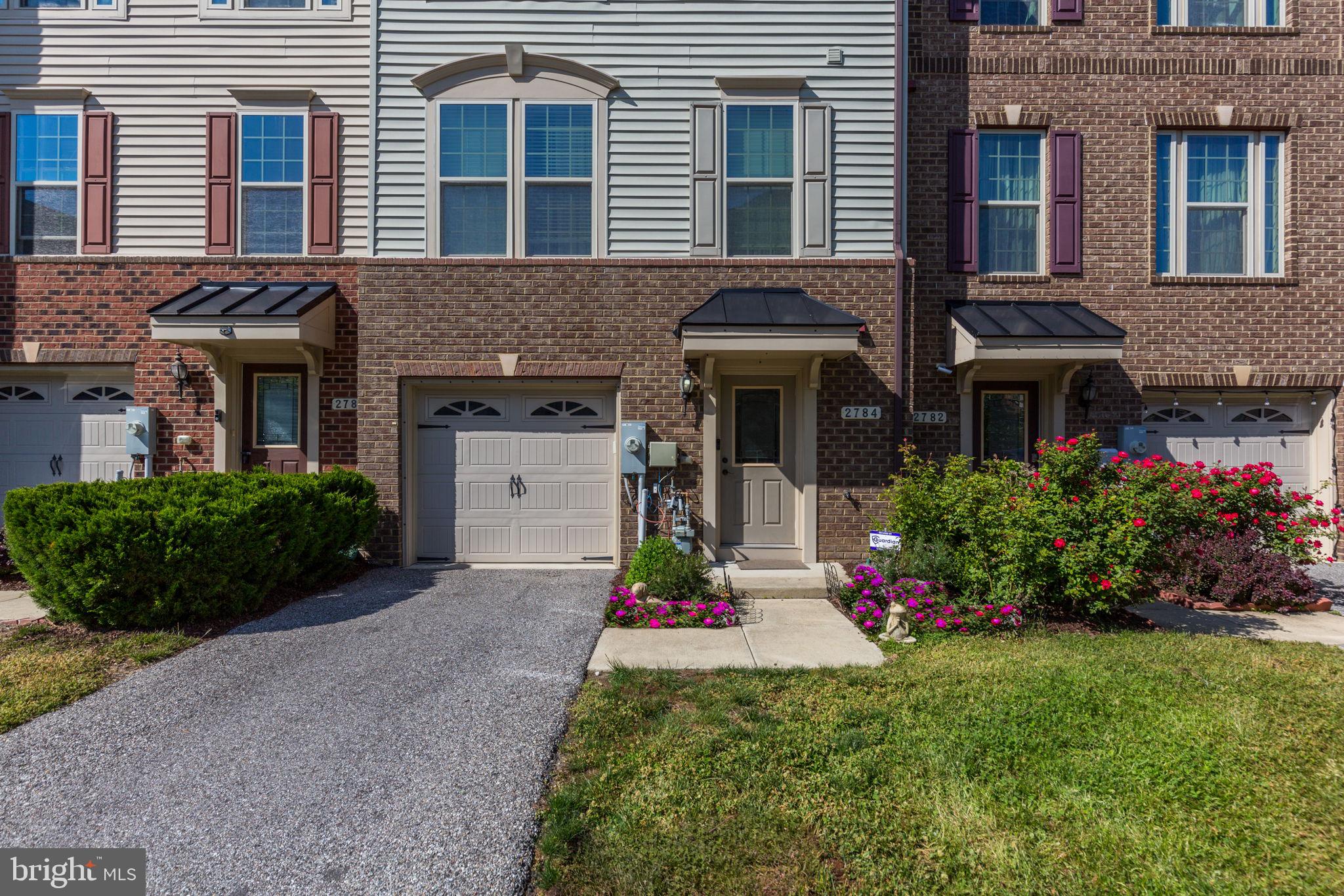 2784 Fredericksburg Road Hanover, MD 21076 - Photo 2 of 60 a front view of a house with a yard