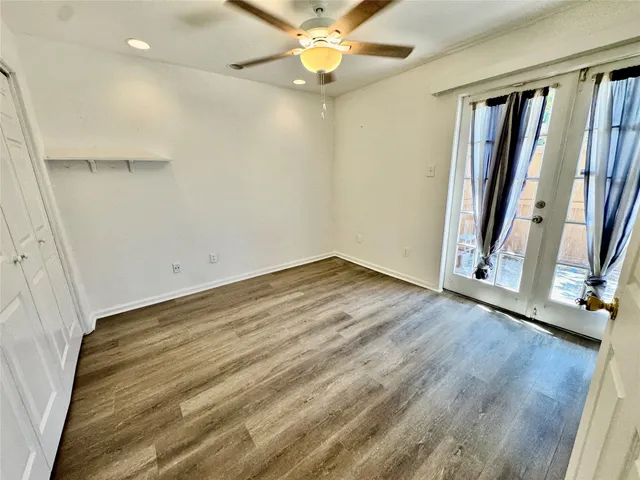 a view of front door with wooden floor
