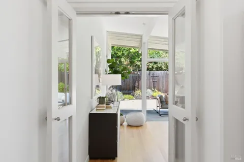 a view of living room with furniture and a window