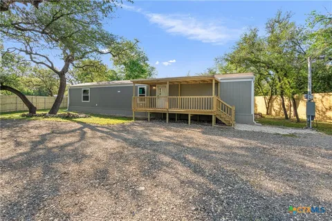 a view of a house with a yard and garage