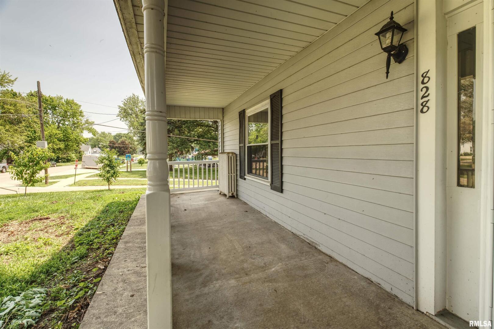 828 10th Avenue Fulton, IL 61252 - Photo 1 of 34 a view of a pathway of the house